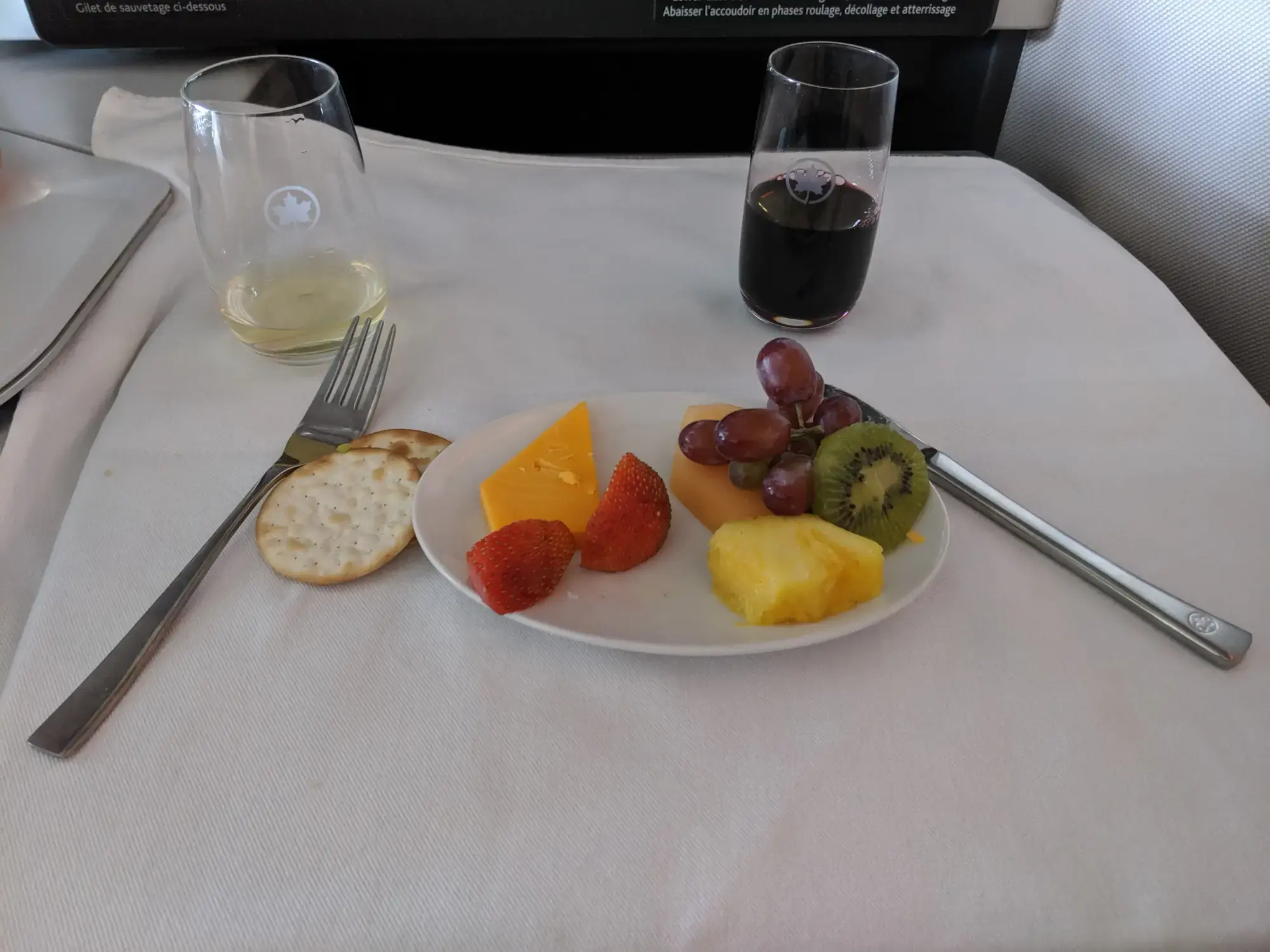 Assorted cheese, fruits, and crackers